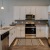 a kitchen with white cabinets