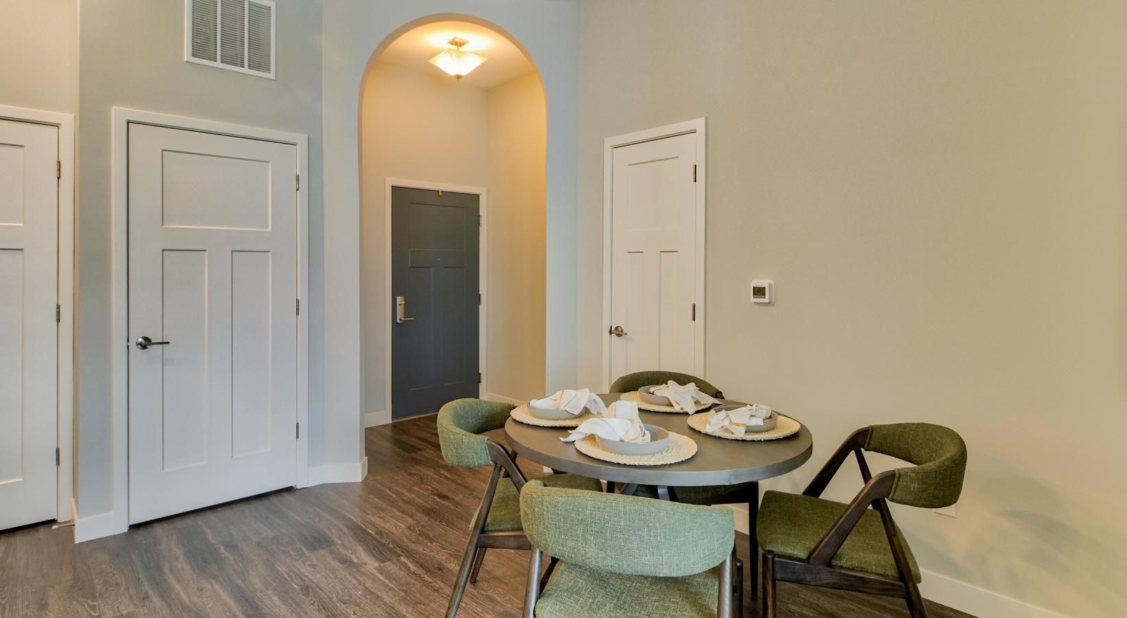 Wide open living areas perfect for entertaining a room with a table and chairs