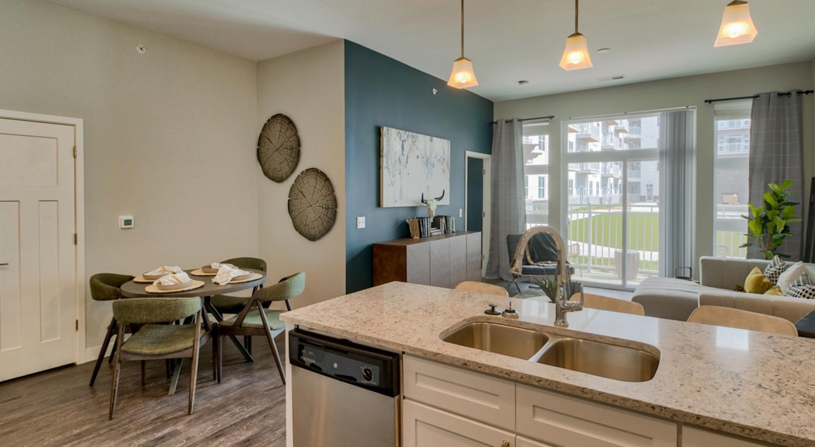 Find your perfect fit at Academy on 4th a kitchen with a table and chairs