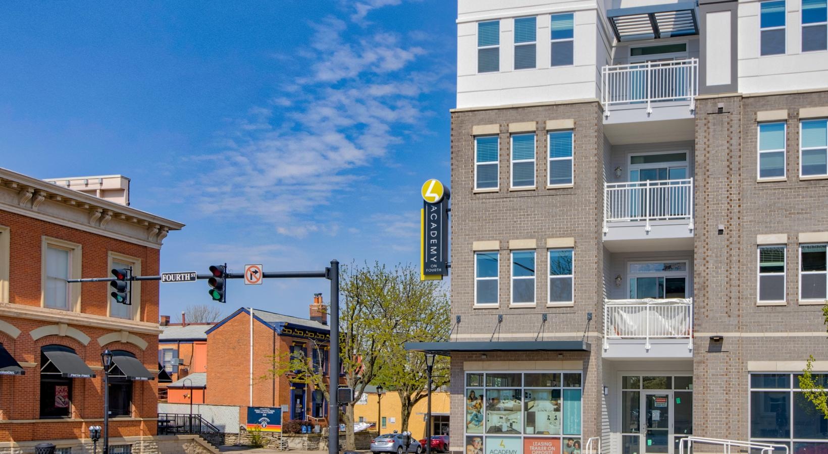 Find your perfect fit at Academy on 4th a street with buildings on the side